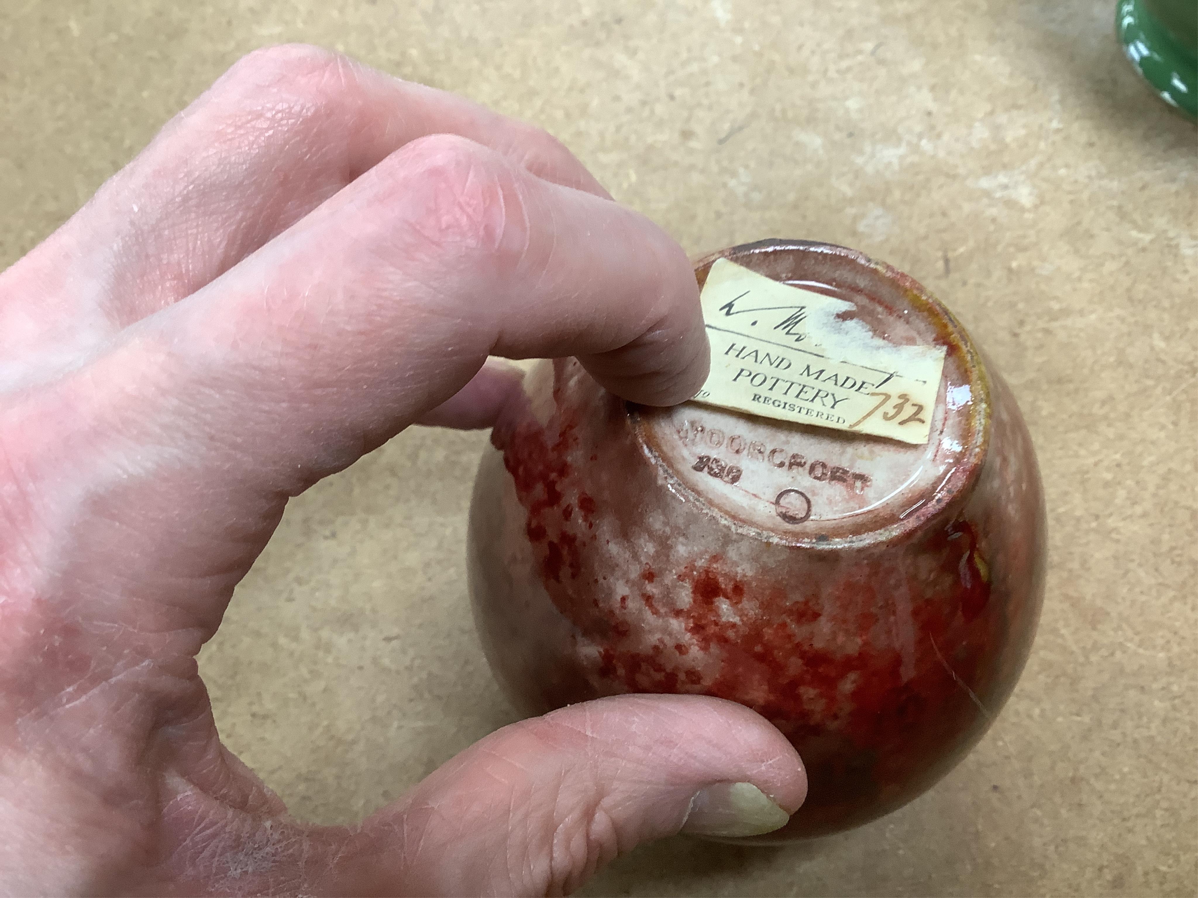 A Moorcroft for Liberty & Co. Flamminion Ware vase, and a smaller Moorcroft vase glazed in a mottled plum flambe, the first 20cm., also to include two Moorcroft reference books